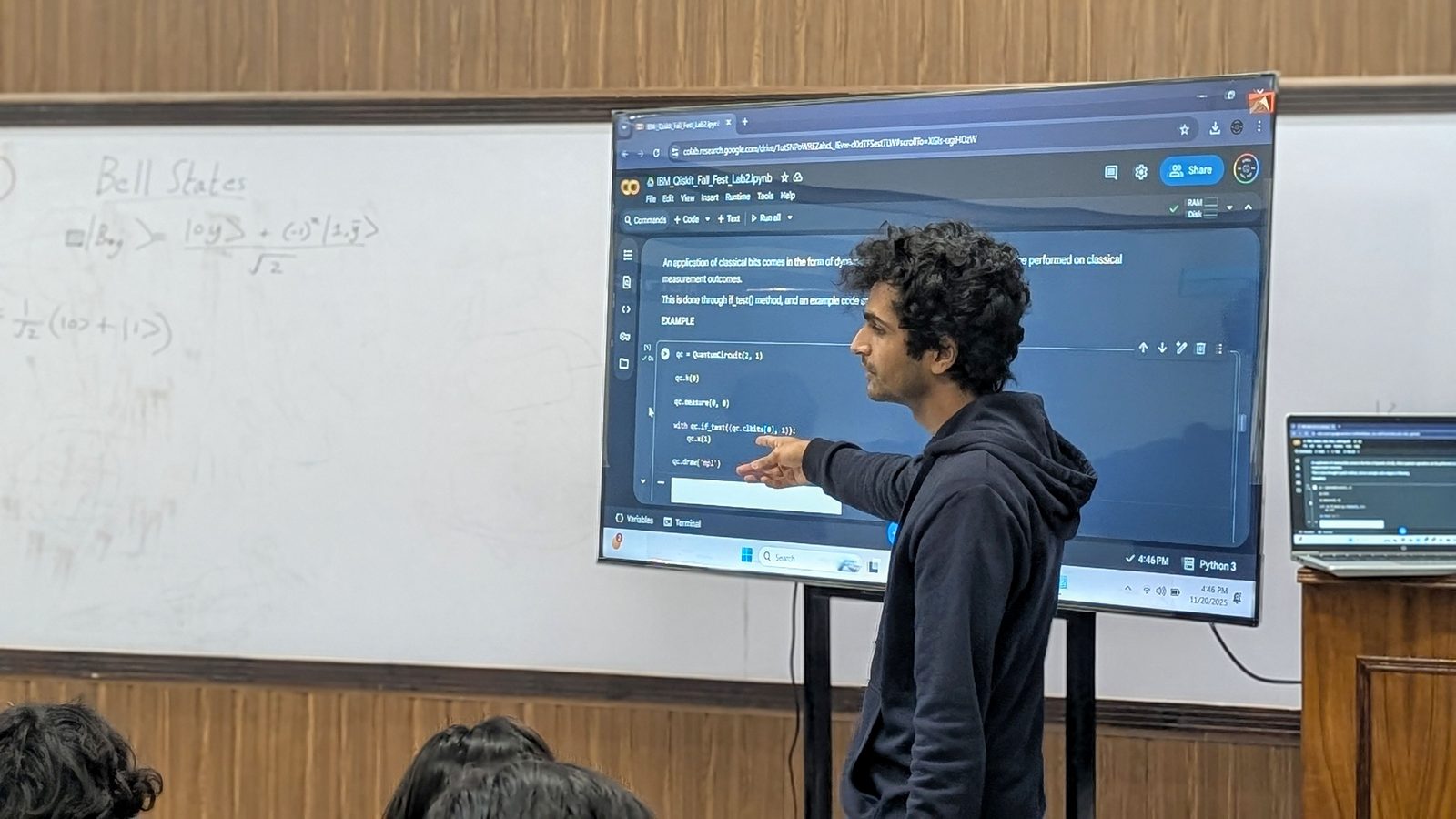 A participant walking the room through their circuit on the projector.